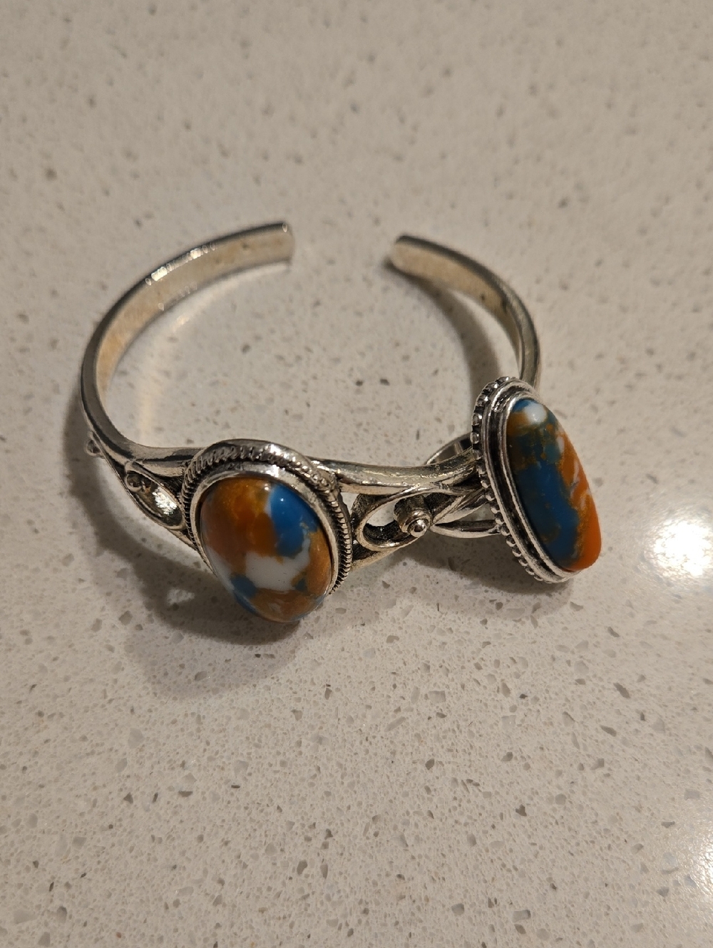 Silver Cuff Bracelet with Blue and Orange Stone Accents